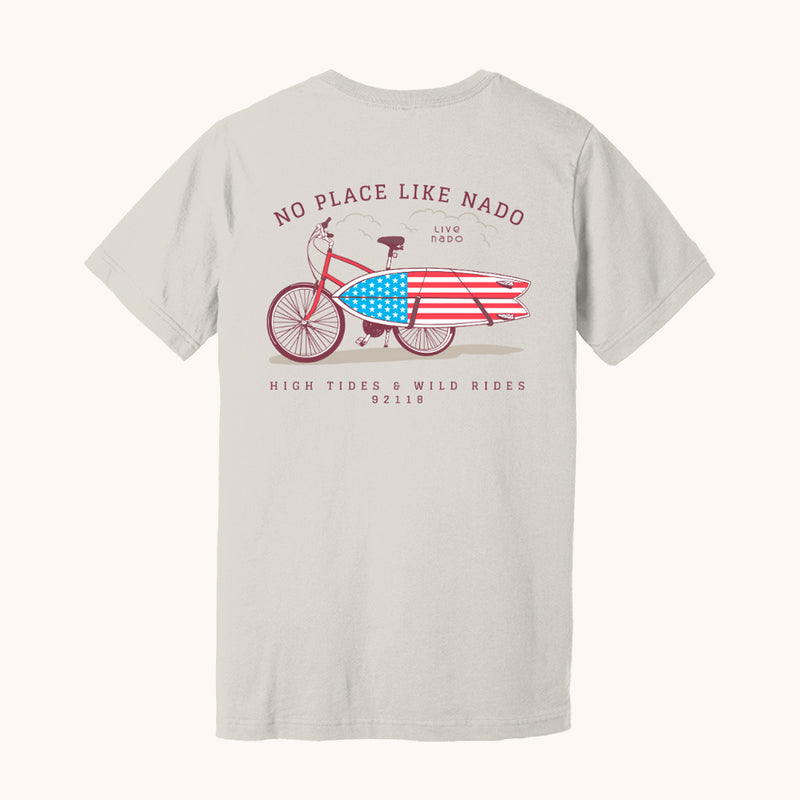 vintage white tshirt that has a bicycle carrying an american flag surf board with the saying no place like nado