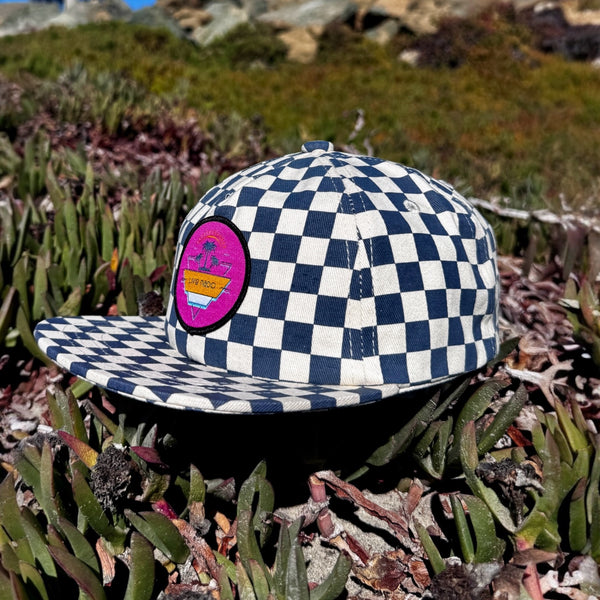 blue checkered baseball cap syrf cap with flat brim and pink patch that says live nado. a hat from coronado california