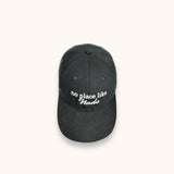 black baseball cap says no place like nado embroidered