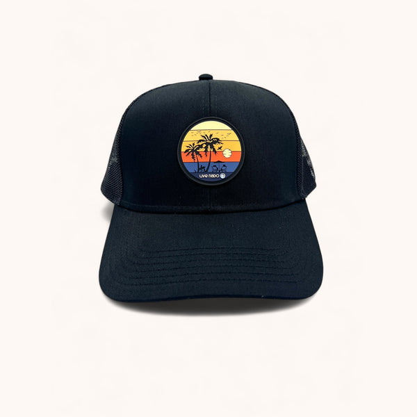 black curved bill trucker with sunset patch made of silocone