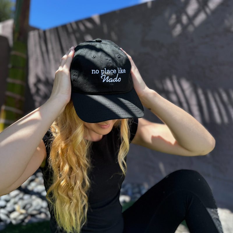 woman wearing black no place like nado dad hat from coronado california